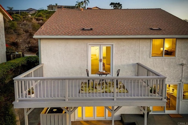 back of property with a balcony