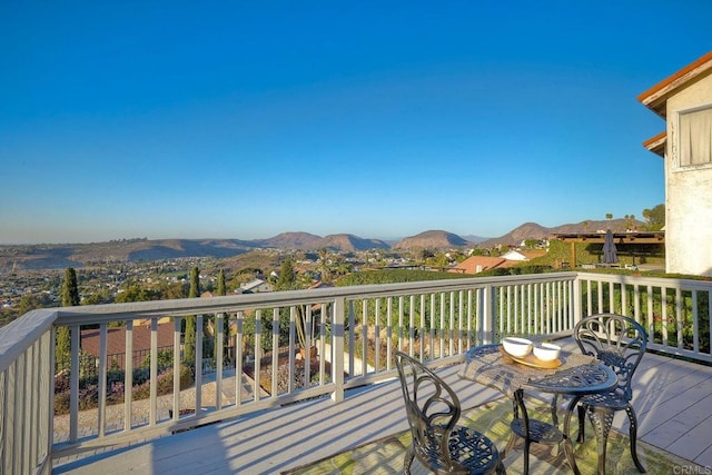 wooden deck featuring a mountain view