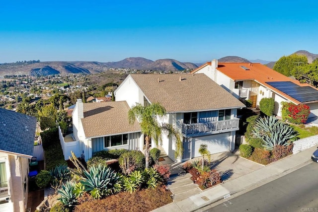 birds eye view of property with a mountain view