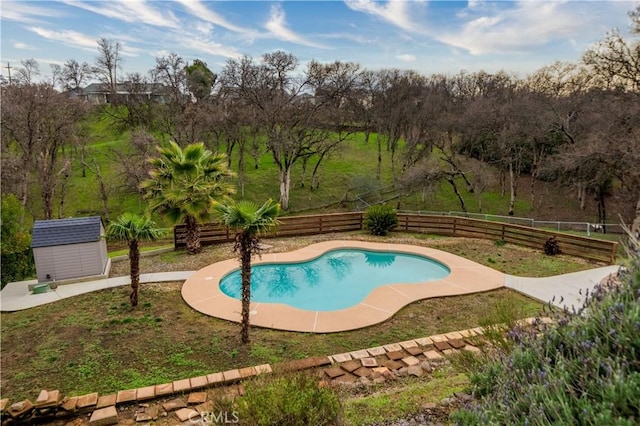 view of swimming pool with a shed