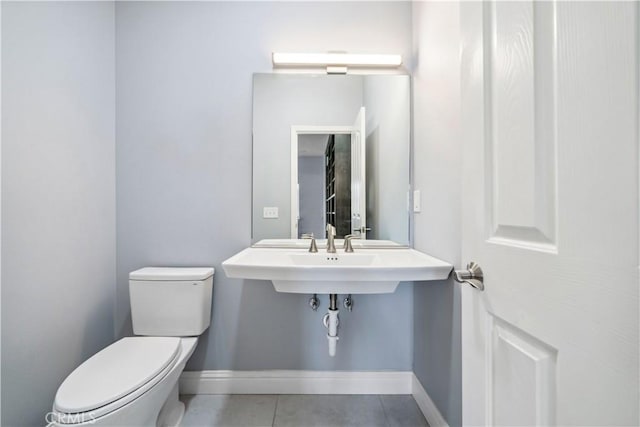 bathroom featuring toilet and tile patterned floors