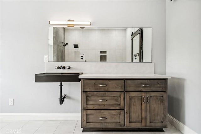 bathroom with tile patterned floors and sink