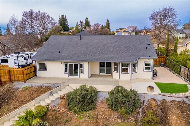 rear view of property featuring a patio