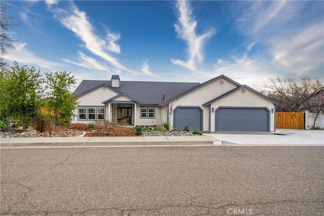 ranch-style home featuring a garage