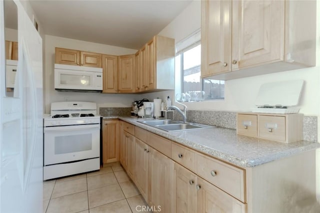 kitchen featuring light tile patterned flooring, white appliances, sink, and light brown cabinets