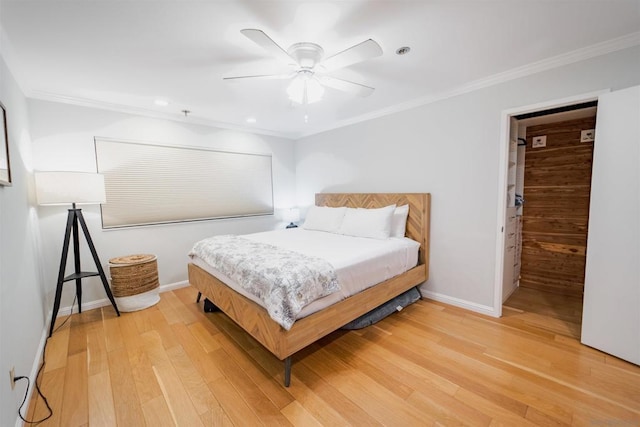 bedroom with ceiling fan, light hardwood / wood-style flooring, and ornamental molding