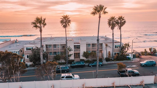 outdoor building at dusk featuring a water view