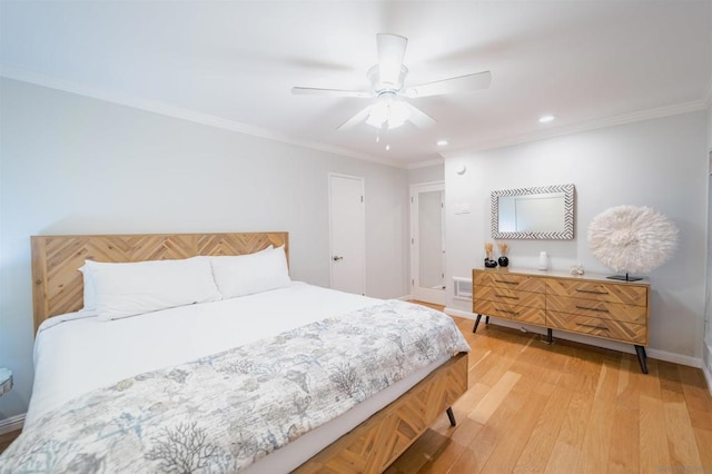 bedroom featuring ceiling fan, ornamental molding, and light wood-type flooring