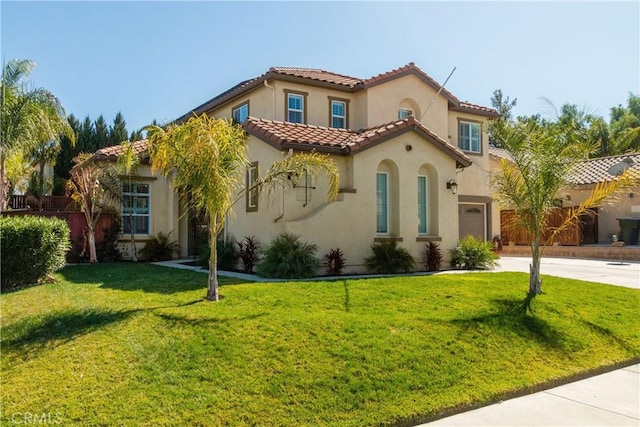 mediterranean / spanish-style house with a front yard