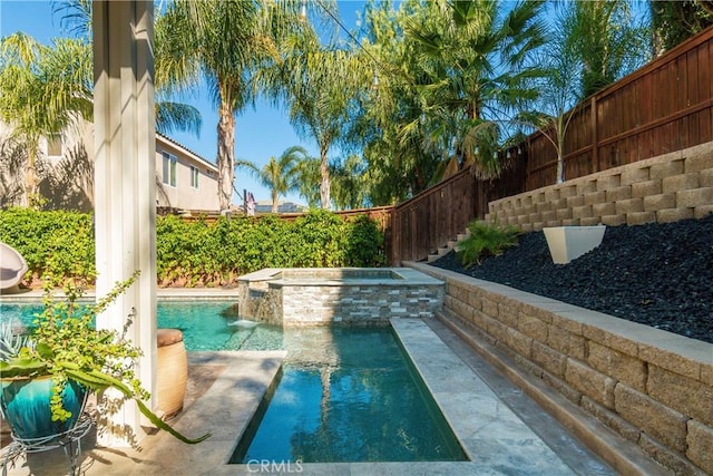 view of swimming pool featuring an in ground hot tub