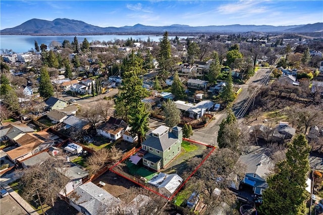 aerial view featuring a water and mountain view