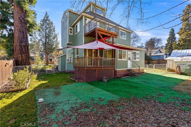 rear view of property featuring cooling unit and a yard