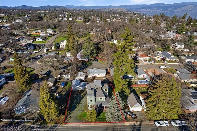 birds eye view of property featuring a mountain view