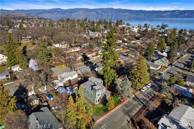 bird's eye view with a water and mountain view