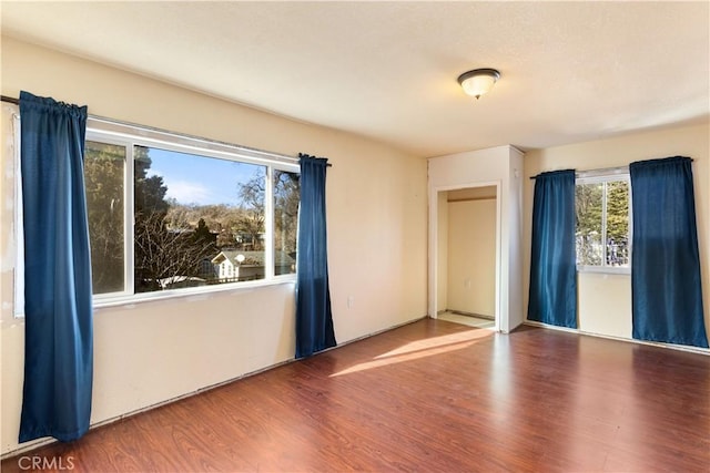 spare room with hardwood / wood-style flooring