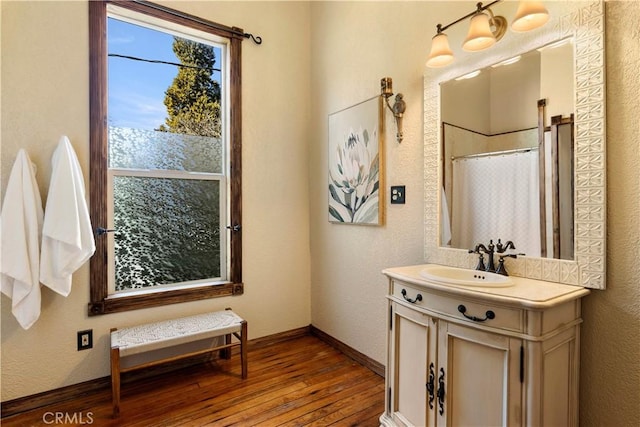 bathroom with vanity, wood-type flooring, and a shower with shower curtain