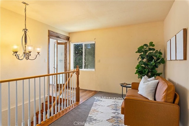 sitting room featuring hardwood / wood-style flooring and a notable chandelier