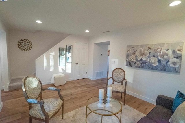 sitting room featuring light hardwood / wood-style flooring