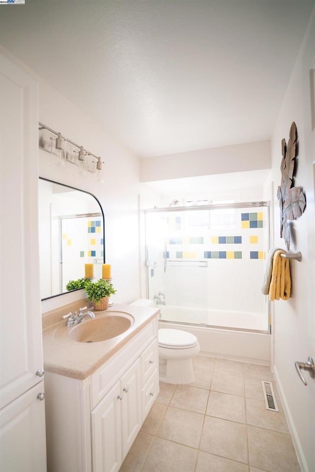 full bathroom featuring toilet, tile patterned floors, tub / shower combination, and vanity