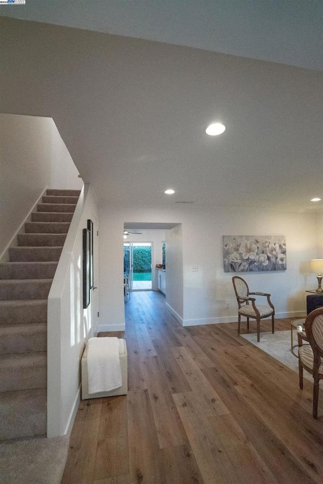 hallway with hardwood / wood-style floors