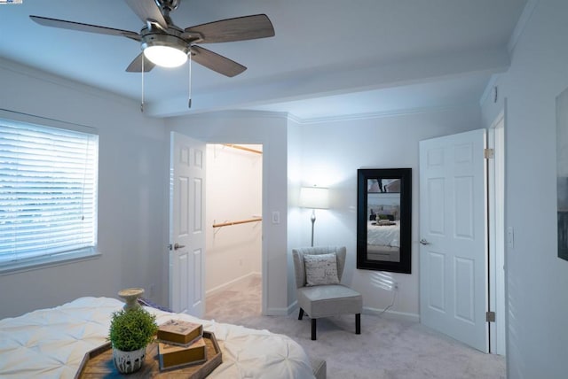 bedroom featuring light carpet, beam ceiling, and ceiling fan