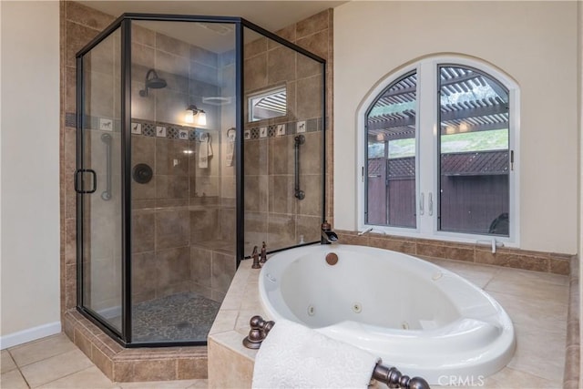 bathroom featuring independent shower and bath and tile patterned flooring