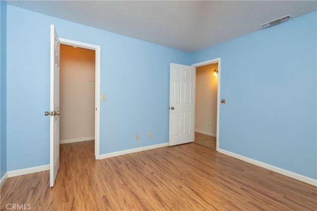 unfurnished bedroom with light hardwood / wood-style flooring