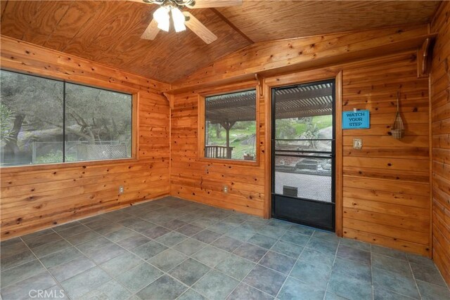 unfurnished sunroom featuring wood ceiling, ceiling fan, and lofted ceiling