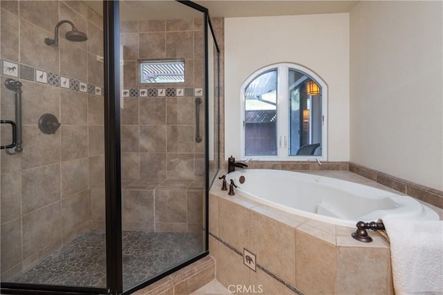 bathroom with separate shower and tub