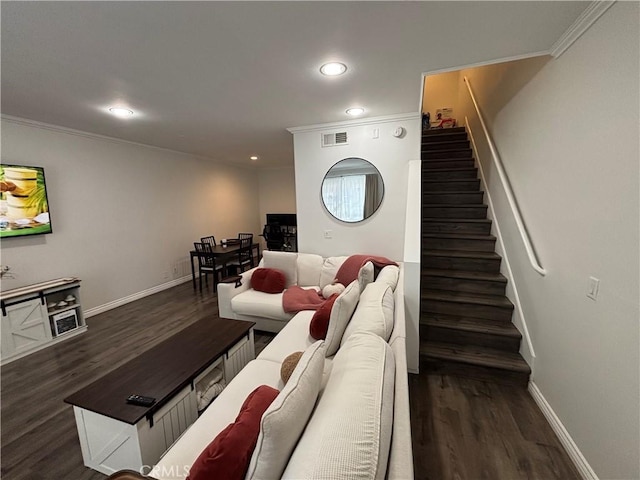 living room featuring ornamental molding and dark hardwood / wood-style flooring