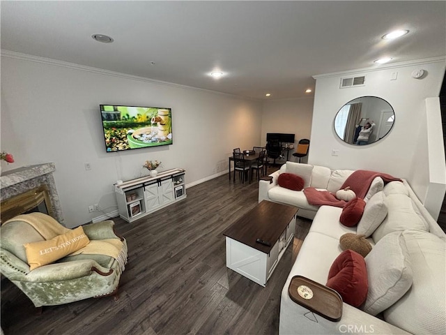 living room with ornamental molding and dark hardwood / wood-style flooring