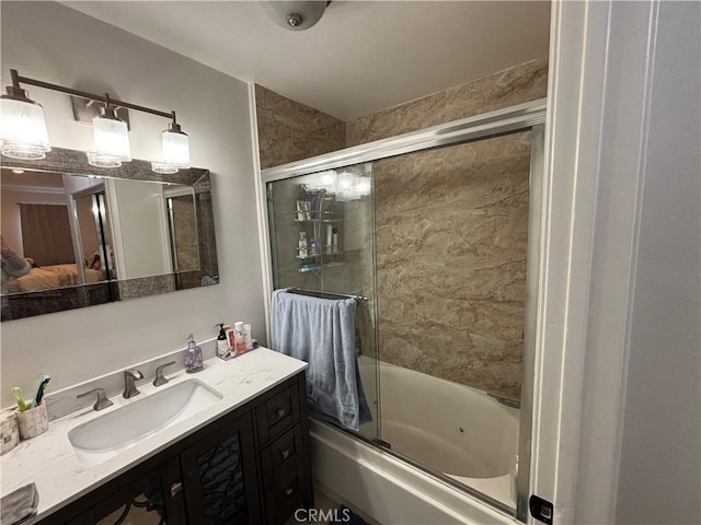 bathroom with vanity and enclosed tub / shower combo