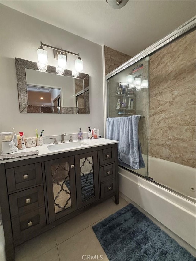 bathroom with tile patterned flooring, vanity, and shower / bath combination with glass door