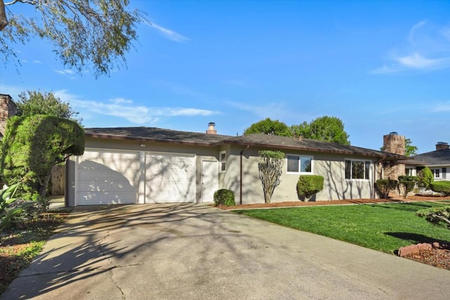 ranch-style home with a garage and a front lawn