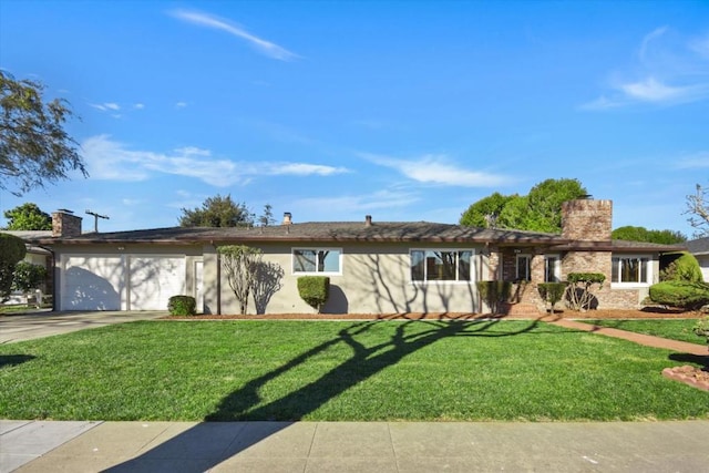 single story home with a garage and a front lawn