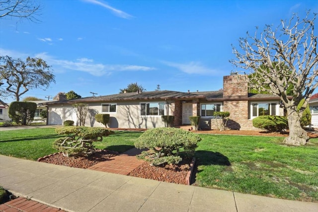 ranch-style house featuring a front lawn