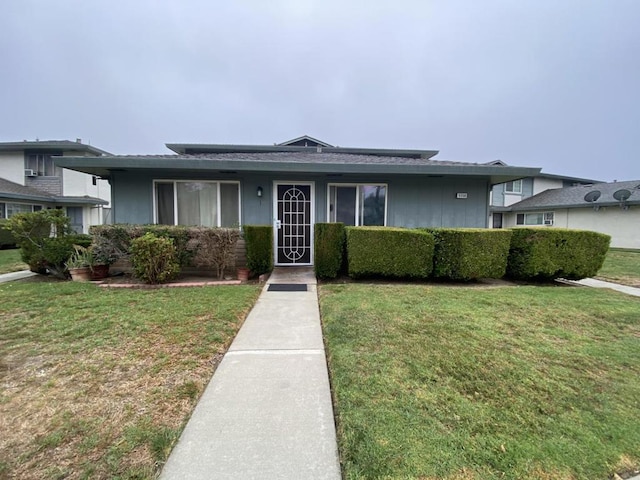 view of front of property with a front lawn