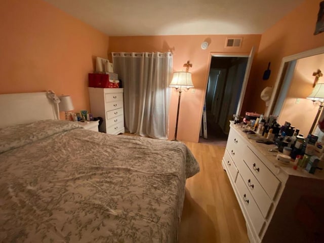 bedroom featuring light hardwood / wood-style flooring