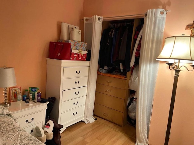 bedroom featuring a closet and light hardwood / wood-style floors