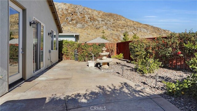 view of patio / terrace featuring a mountain view