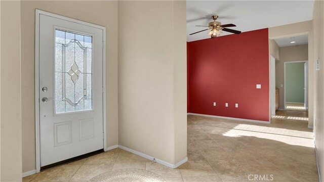 entrance foyer with ceiling fan