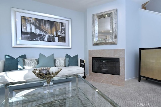 carpeted living room featuring a fireplace