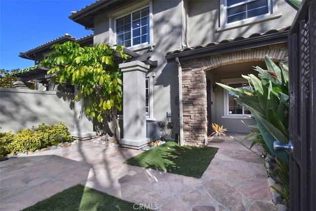 doorway to property featuring a patio area