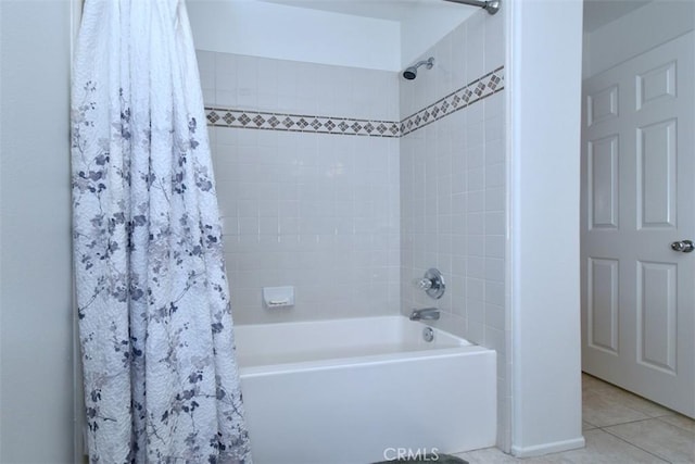 bathroom featuring shower / bathtub combination with curtain and tile patterned floors