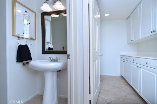 bathroom featuring tile patterned floors and sink