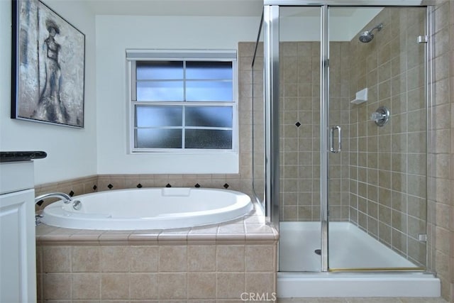 bathroom featuring vanity and plus walk in shower