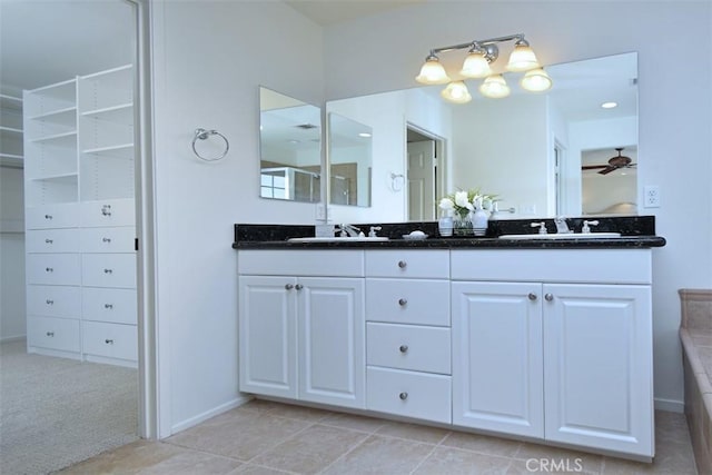 bathroom with ceiling fan and vanity