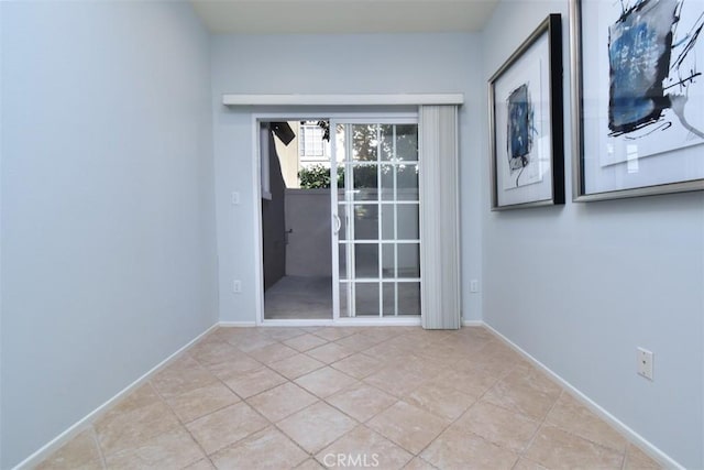 empty room with light tile patterned floors