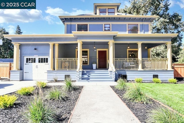 view of front of property featuring covered porch, a garage, and a front lawn