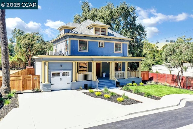 view of front of home with a front lawn, a porch, and a garage